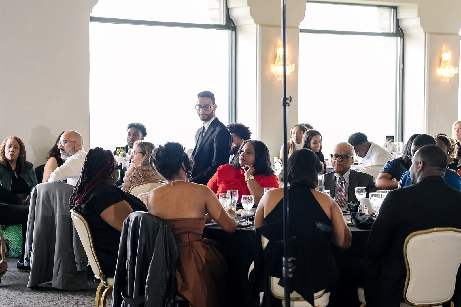 Guests seated at round tables during the Legends Among Us luncheon at The Highlawn.