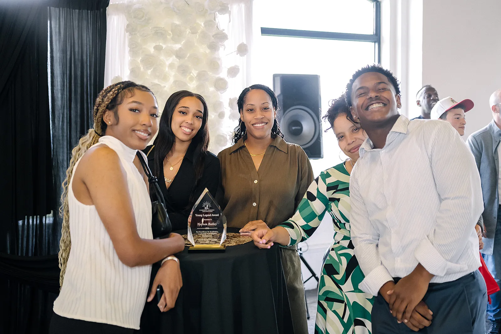 Nathan Bailey with his Young Legend Award and guests at the Legends Among Us luncheon.